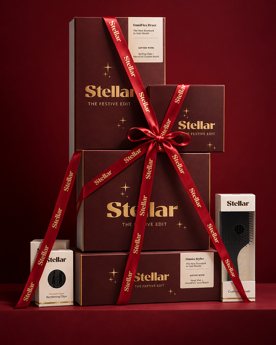Stellar Festive Edit Christmas gift boxes tied with red ribbon, with the words “Wrapped for better hair days”.